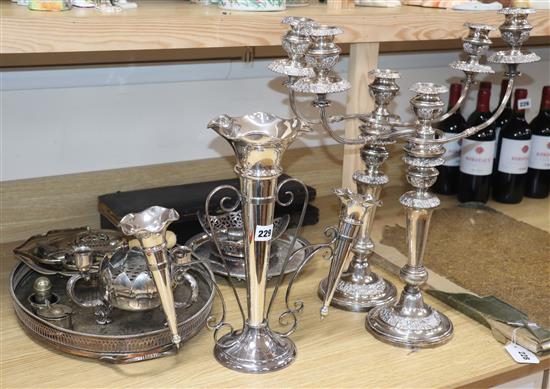 A silver plated epergne pair of candelabra, carving sets etc